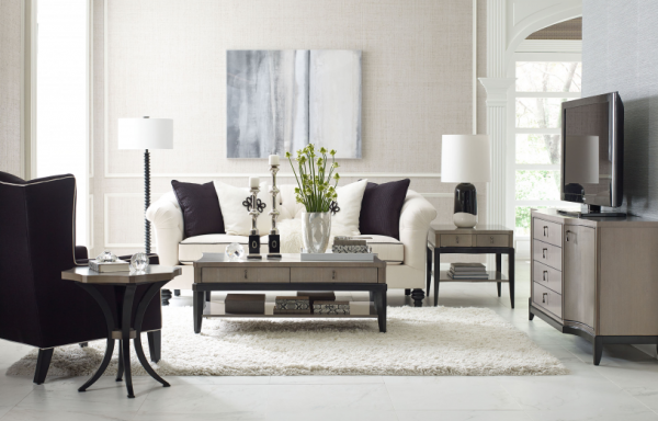 luxury living room featuring white and black color scheme with white shag rug with white sofa and black chair with grey furniture